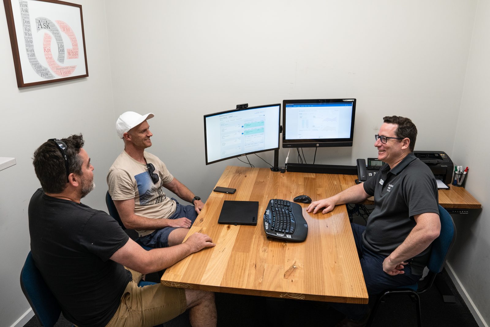 Clayton Wood of Business Edge Advisors in a desk meeting with a client